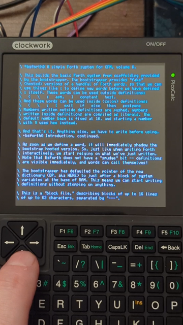 Me interacting with the PicoCalc, which is showing a screen of Forth code. The cursors cause it to smooth scroll up and down, and I use this to page around.