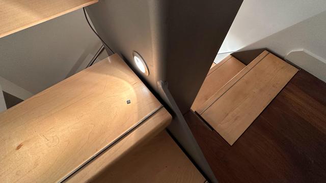Stairs with a tiny tiny ice 40 fpga illuminated in the foot lights.
