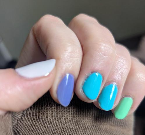 Pastel nail colors: sky blues, minty green, purple, and what looks like a white