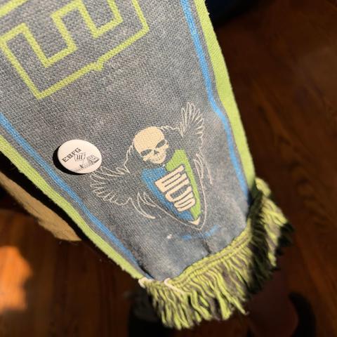 Faded ECS soccer scarf with a single pin of Tom waving the Iron Front anti-fash flag