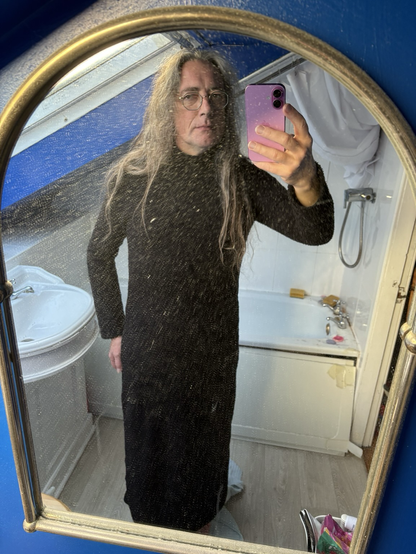 bathroom mirror selfie in a black long-sleeved maxi jumper dress