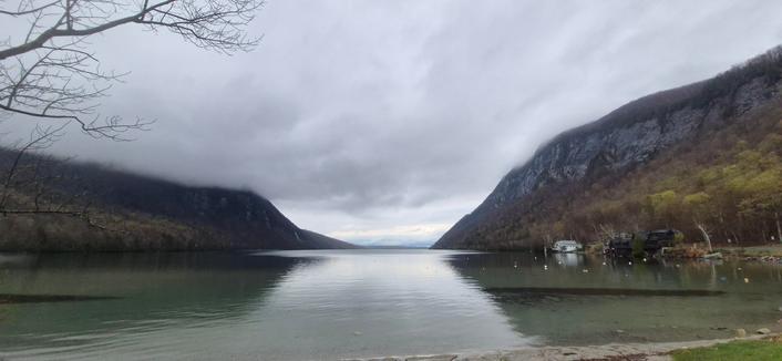 Lakeview with a gap between two mountains.  Clouds cover the peaks.