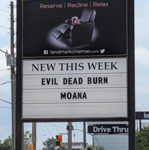 A movie theatre sign advertising:
New this week
Evil dead burn Moana