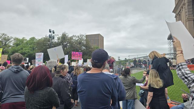 Anti Trump signs in the massive crowd like If You Tolerate This Your Children Are Next 