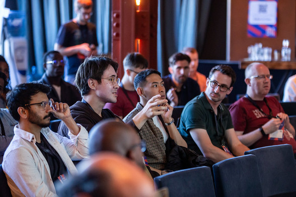 Participants discussing topics at the Barcamp