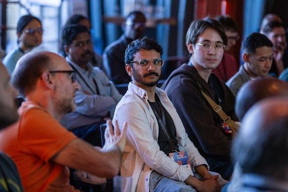 Attendees discussing their topics at the barcamp 2024