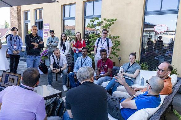 Attendees discussing their topics at the barcamp 2024
