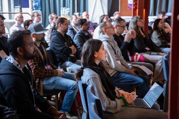 Berlin Buzzwords attendees listening to a talk on stage