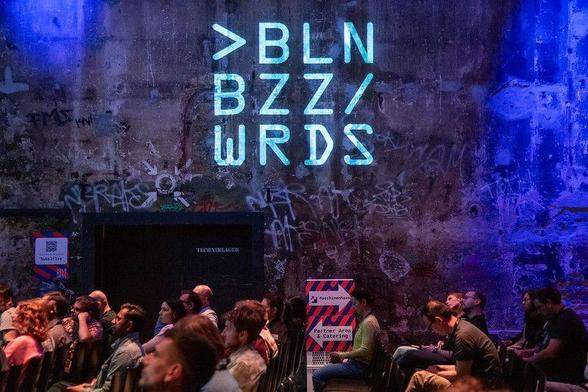 Berlin Buzzwords attendees listening to a talk on stage 