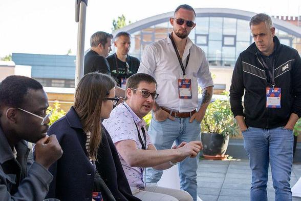 Barcamp attendees discussing topics on the roof top of Kulturbrauerei