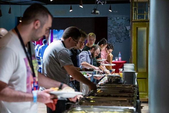 bbuzz attendees standing at a buffet