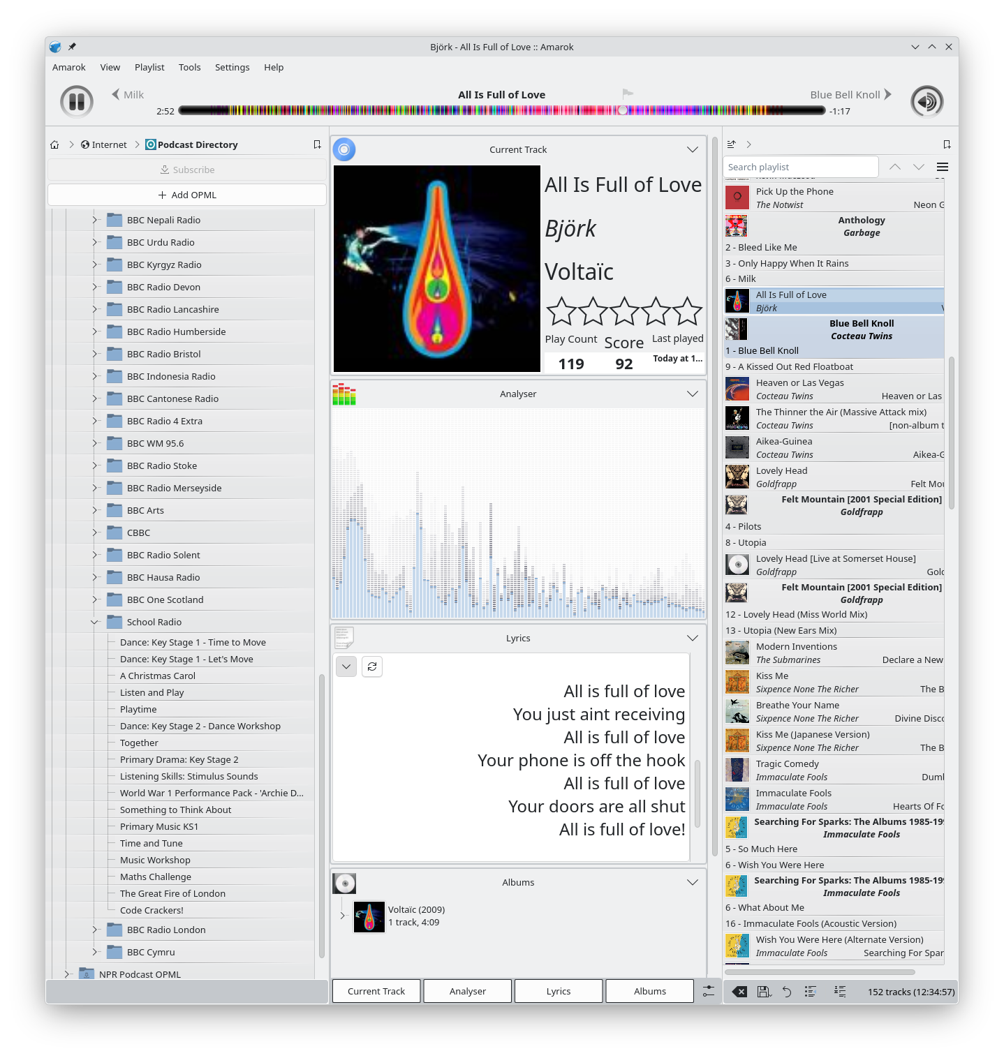 Amarok, showing a song by Björk playing. At the top there is a moodbar, on the left there is a list of BBC educational podcasts, in the center information about the song, including the lyrics, and on the right a playlist.