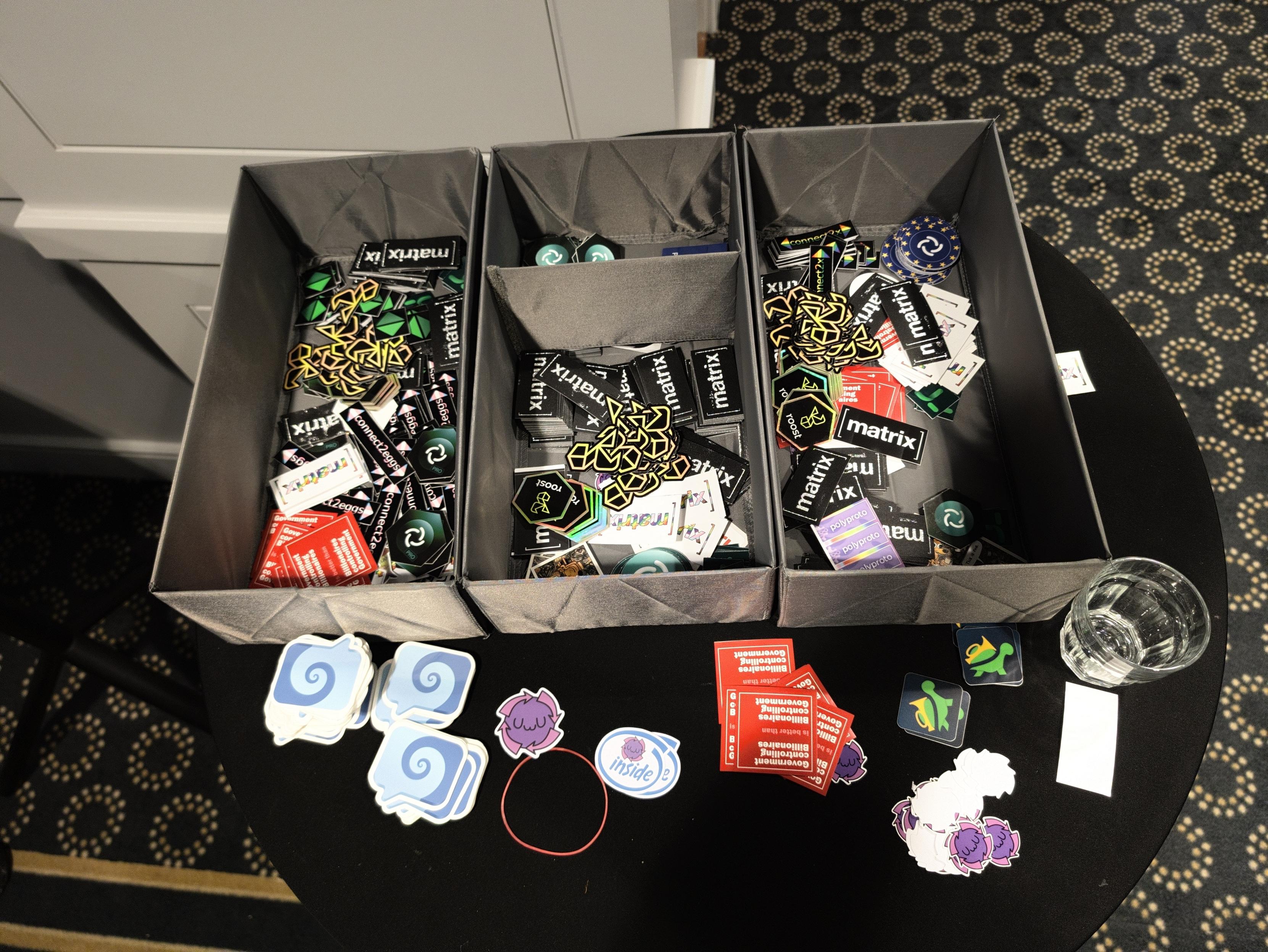 Boxes full of stickers, including Element, ROOST, Matrix, and Fractal logos