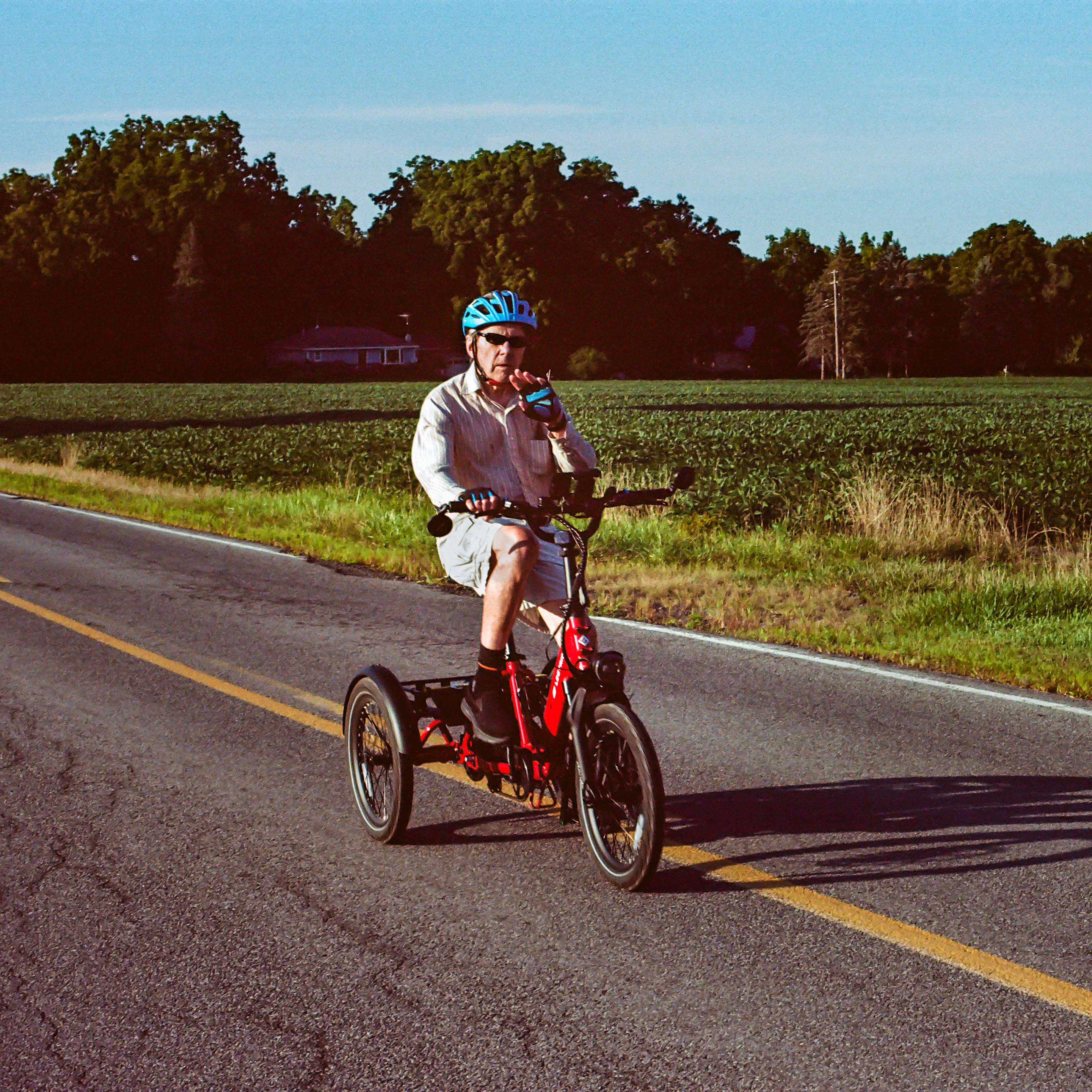 Pushing up a long grade on a 3-wheeler and seeing a random photographer. August 15, 2026 6:31pm.

Canon F-1 | FD 50mm f/1.4 | Porta 160 (exp 2024) | 1/250 at f/10 | dev/scan The Darkroom Lab | traditional treatment in LR/PS