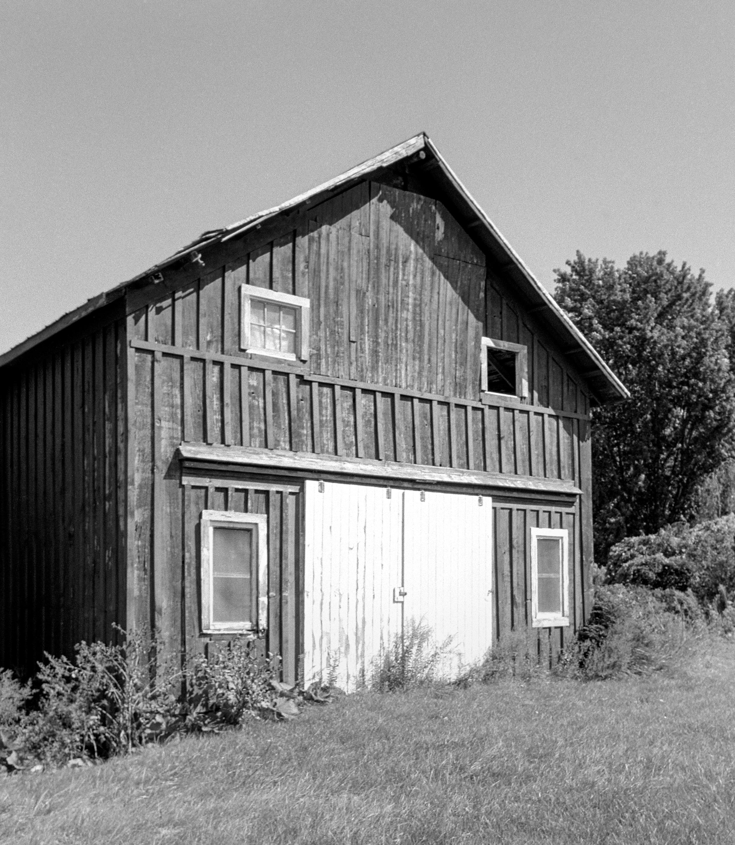 September 7,  2026, 2:50pm. Town of Ulysses, Finger Lakes, upstate New York

Pentax ME Super | 28mm f/2.8 | T-Max 100 | 1/125 at f/6.7 | ID-11 1+1 9:39 at 19.8 C | m43 scan, grain2pixel | traditional treatment in LR/PS

I used the 28mm as a shift lens by pointing horizontally, orienting the camera vertically, and cropping the lower portion of the image. I exposed for the detail in the upper-right window. This negative would be hard to print in a wet darkroom, way too much contrast.