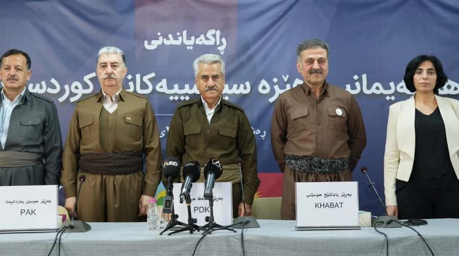 leaders of 4 small militant Kurdish groups , like those in Baluchistan to coordinate their fights for regime change in Iran
