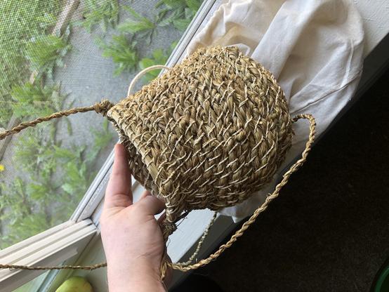 A basket made of blackberry vines, made up in a coil building manner.