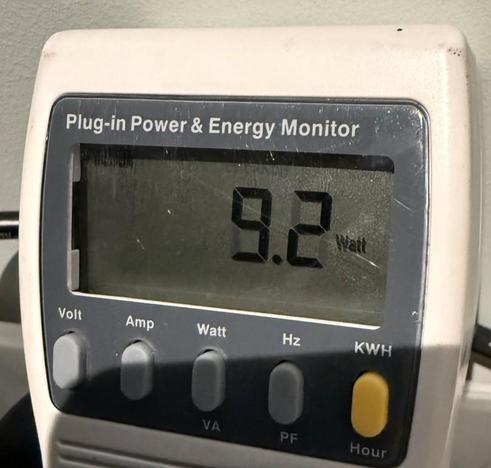 A tightly cropped photo of a "Plug-in Power & Energy Monitor" set to Watts showing an instantaneous power reading of 9.2W