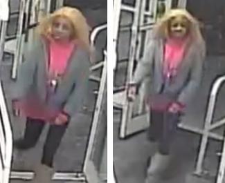 Knifewoman in pink top, gray jacket, gray boots, blonde wig