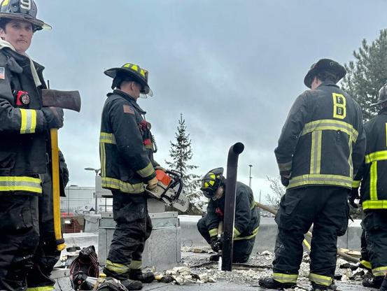 Firefighters on roof of Wood Island Blue Line station, photo by BFD