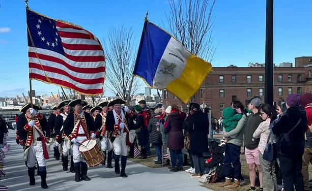 Revolutionary re-enactors marching to top of Dorchester Heights to menace Redcoats with cannons