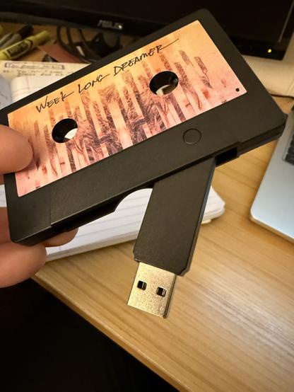 Chris DeClerk's album, Week Long Dreamer, on a cassette usb.