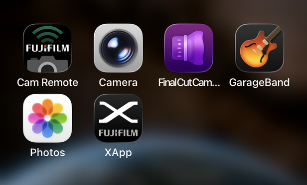 Two rows of app icons. Third from the left in the top row is a weird purple blob thing that’s supposed to look like a camera lens, I guess, if you stare at it for 5 minutes