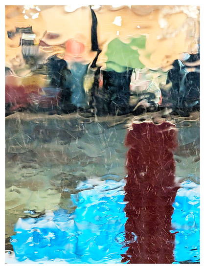 abstract through a rain-smeared windshield, parked in front of a well-lit convenience store.