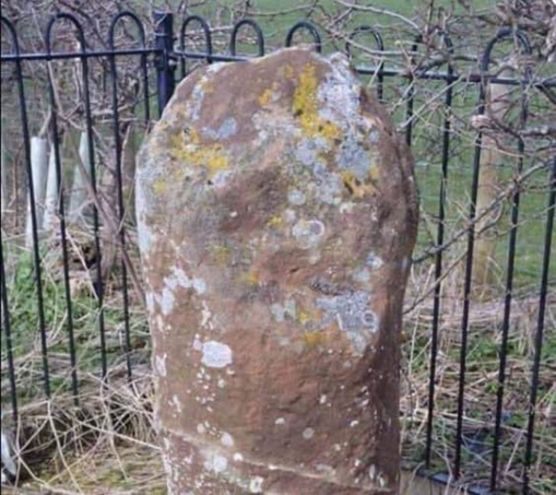The picture is of an old mile post marker