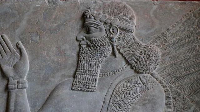 Stone relief of nebuchadnezzar ii features long hair and a massive beard
