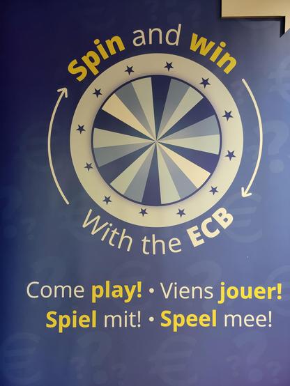 Ad for the ECB booth with a spin-the-wheel saying "spin and win with the ECB — come play!"