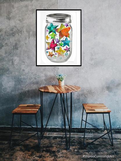 Colorful stars in a mason jar on crisp white by artist Sharon Cummings.  Decor Setting.