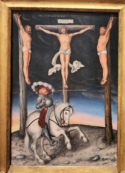 crucifixion scene with the two thieves close to Jesus' left and right. below them is a centurion in anachronistic wide hat and suit of iron riding a white horse. above him is the caption
WARLICH DISER MENSCH IST GOTES SVN...
above jesus is the caption
VATER IN DEIN HET BEFIL ICH MEIN GAIST