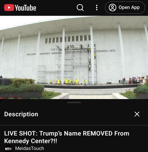 Screenshot of
Trump's Name REMOVED From Kennedy Center
live on youtube
distant shot of workers in high vis erecting scaffolding to facilitate the removal of letters from high on a wall