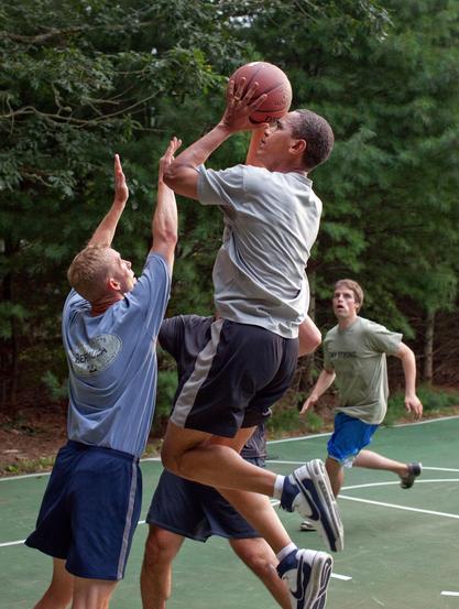 President Barack Obama plays basketball with White House staffers while on vacation on Martha's Vineyard, Aug. 26, 2009.