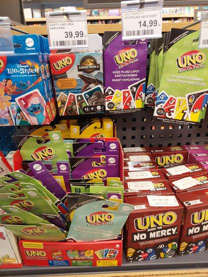 Variety of Uno card fame products, including slim packages of expansion cards