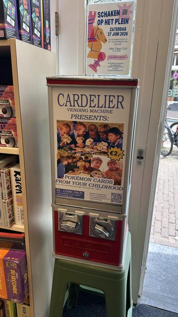 coin vending machine labeled "Pokemon cards from your childhood.  We're not assuming your age. All cards < 2003" for 2 euros in coins.