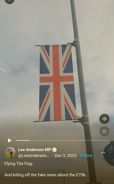 The Union Flag upside down hanging from a lamppost