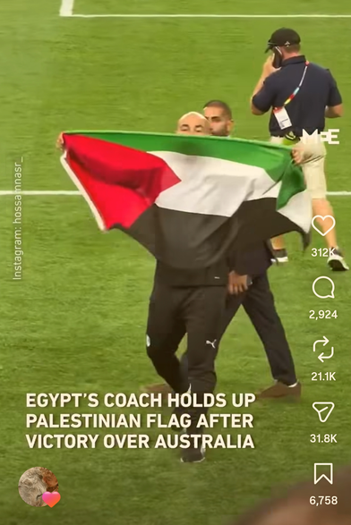 Coach holding the Pally Flag
