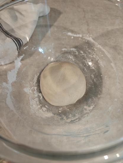 A wee little ball of sourdough preferment rests smooth and taut in it's bowl for the night.