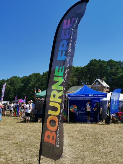 Bourne Free flag. Tents in background