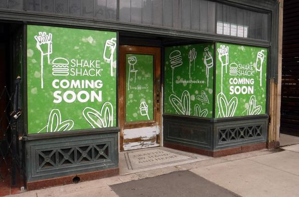 former Britnell's store (with the mosaic "crafted by hand and heart" in the doorway), being renovated, has papered its door and windows with green and white signs announcing "Shake Shack coming soon"