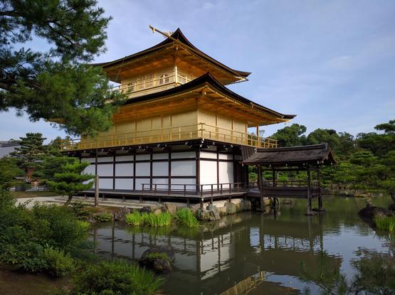 The gold leaf covered hall of Kinkaku-ji by the pond next to it
(Photo mine)