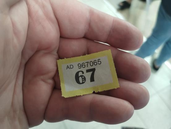 a raffle ticket with the number 67 on it.