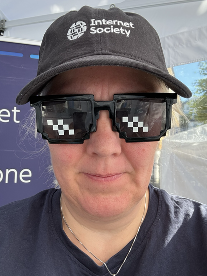 Caps and Minecraft sunglasses on white woman