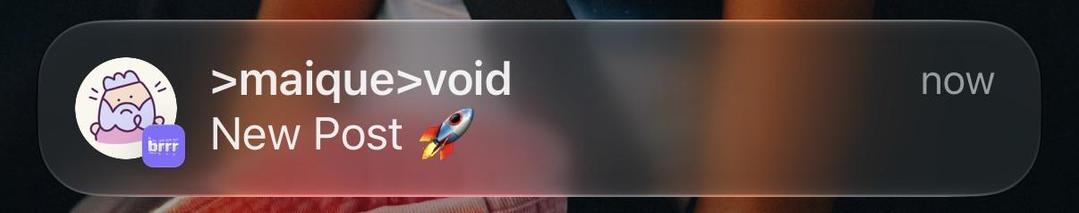 Mobile notification showing a new post from the user “>maique>void” with a rocket emoji, alongside a profile picture of a pink cartoon character with a small purple “brrr” label.