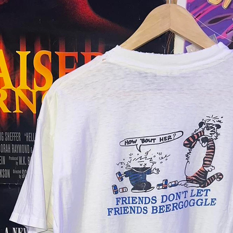 Calvin and Hobbes.

Calvin is trashed, and say, "How about her?"

Hobbes has his eyes covered.

Main line: "Friends don't let friend beergoggle"