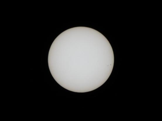 Cropped picture of the sun taken through a telephoto lens and an ND100000 filter.