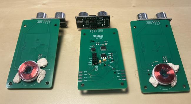 Three circuit boards. One electromagnet is sitting on each, plus a dozen other patrts, and a strange breakout board at the far end.