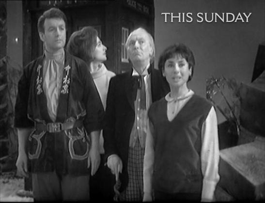 Black-and-white still Doctor Who showing Ian, Barbara, the Doctor, and Susan standing together outdoors in front of the TARDIS, all looking upward with concerned expressions.